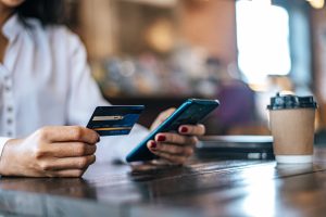 Pay Goods By Credit Card Through Smartphone Coffee Shop Scaled